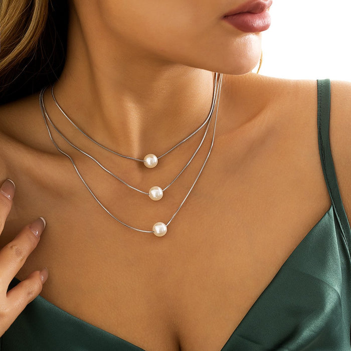 Multi Layered Geometric Snake Bone Pearl Pendant Necklace