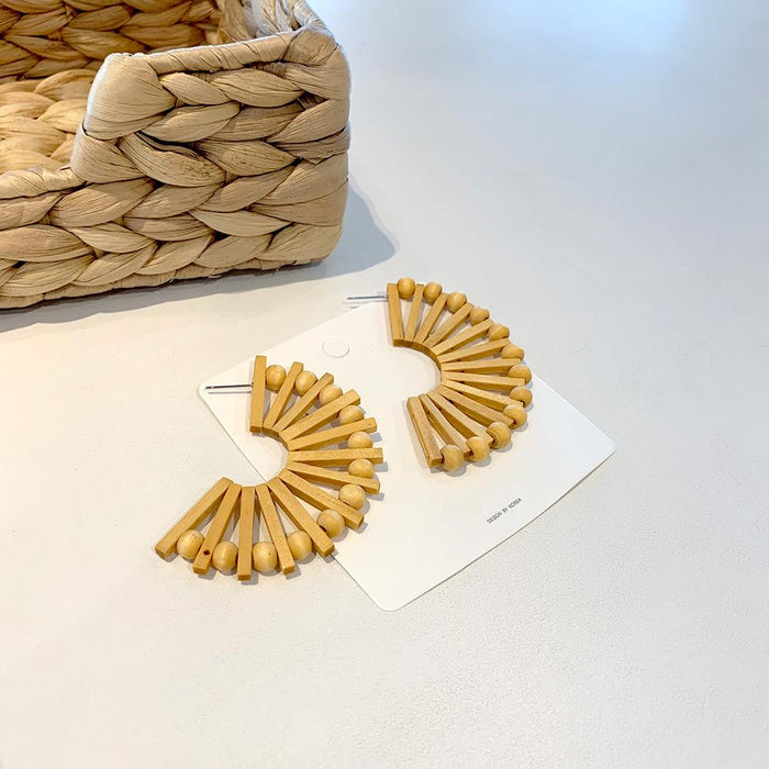 Exaggerated Fan-shaped Hollowed Round Wooden Earrings Female
