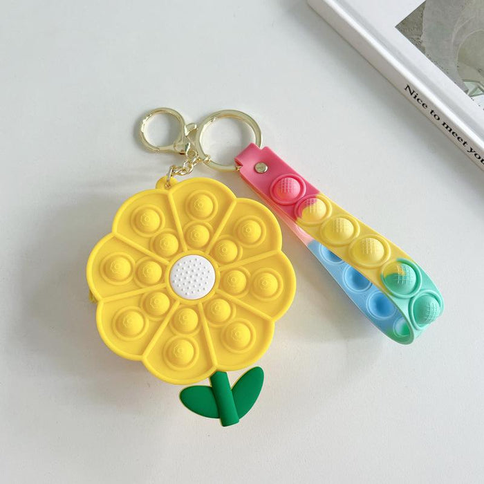 Cartoon astronaut pinching a small coin purse keychain