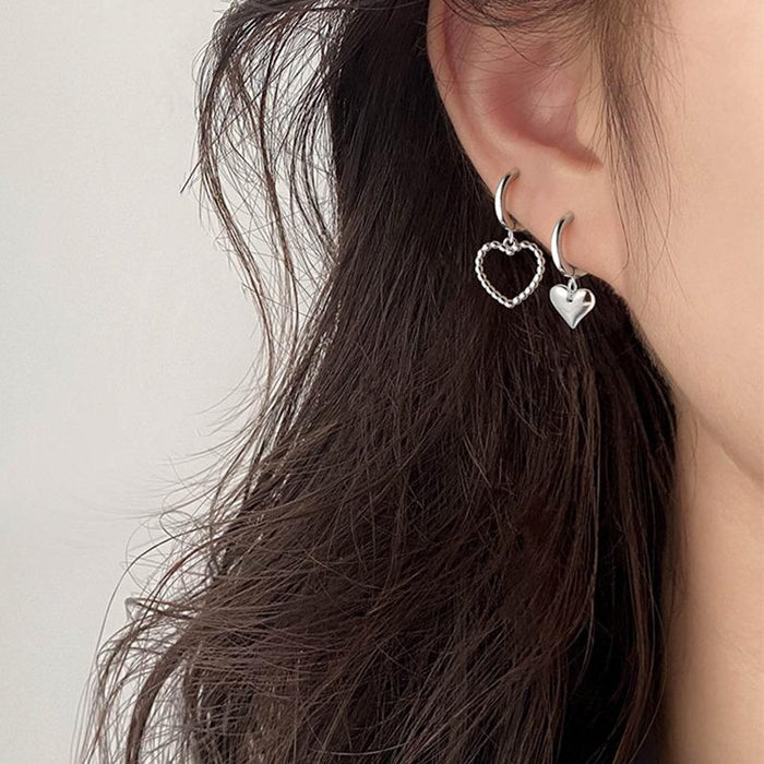 Asymmetric heart earrings