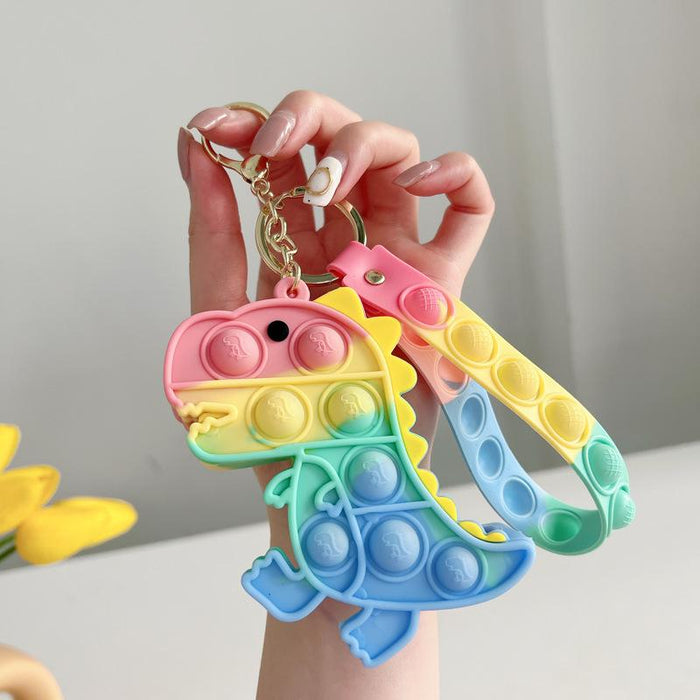 Cartoon astronaut pinching a small coin purse keychain