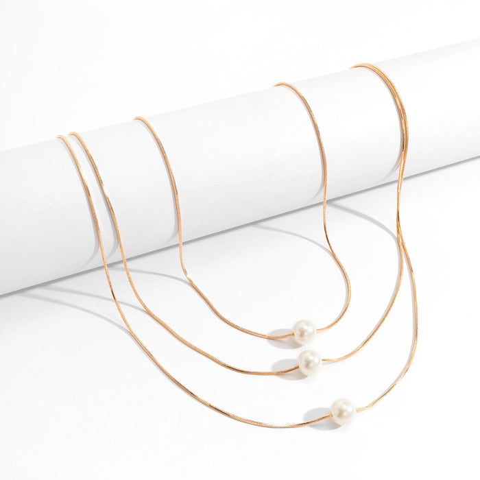 Multi Layered Geometric Snake Bone Pearl Pendant Necklace