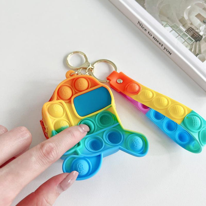 Cartoon astronaut pinching a small coin purse keychain