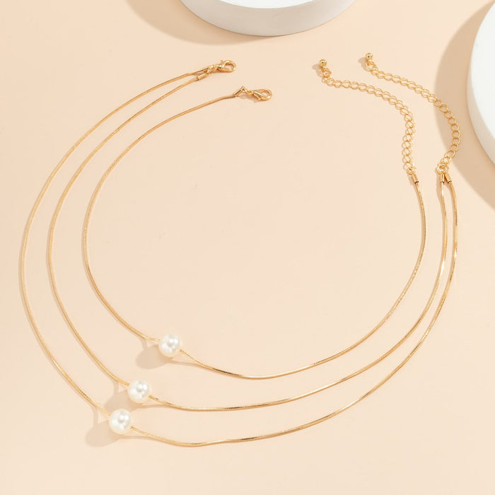 Multi Layered Geometric Snake Bone Pearl Pendant Necklace