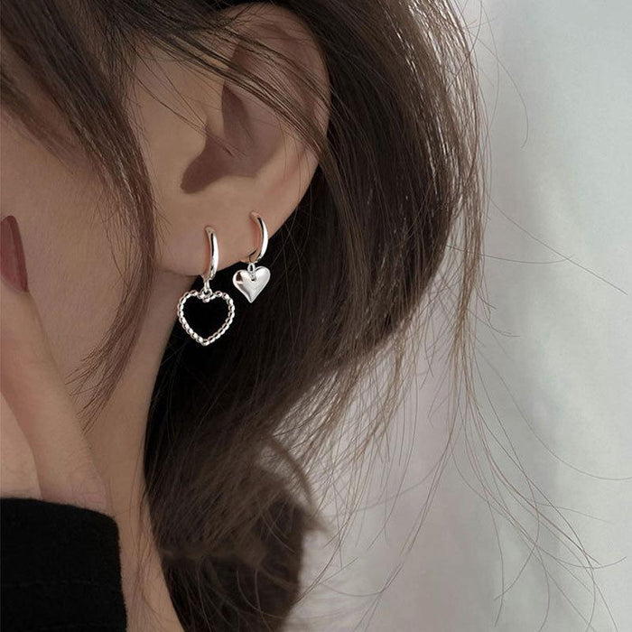 Asymmetric heart earrings